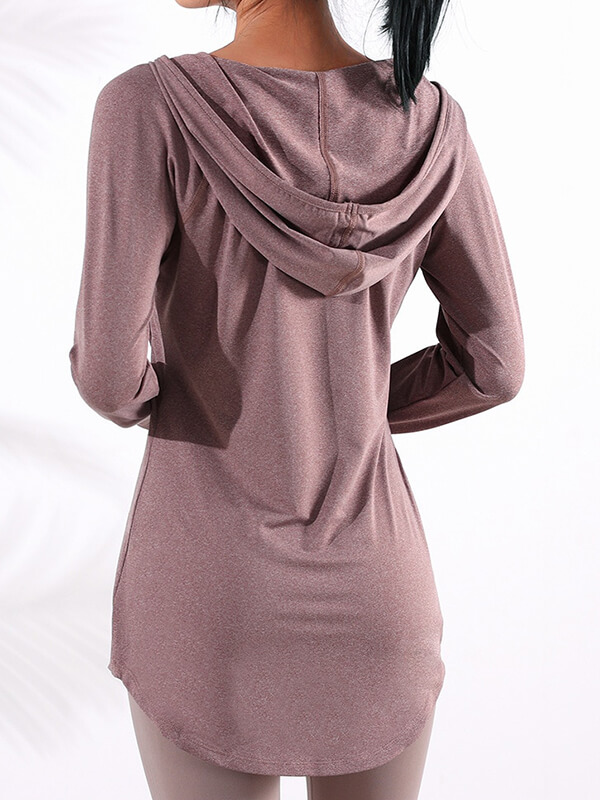 Back view of a woman wearing a brown sports loose hooded sweatshirt, showing long sleeves and relaxed fit for fitness activities.